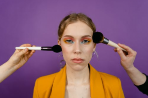 Makeup artist applying makeup to a woman