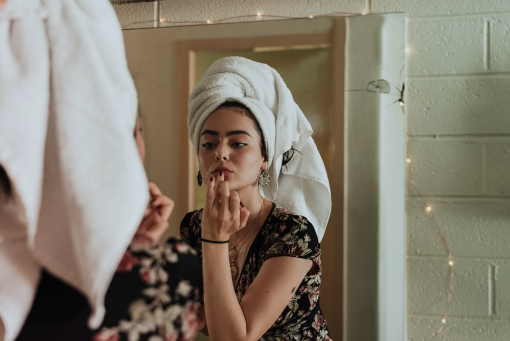 A Woman Applying Makeup