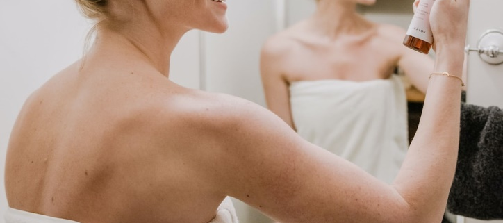 Woman using skincare cosmetics